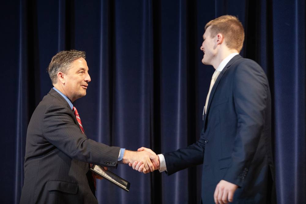 Charles Przybylo shaking hands with Dr. Smart